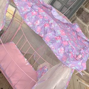 A beautiful flowered baby doll bed